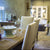 Dining room with a table set for a meal, chairs, and decorative items.