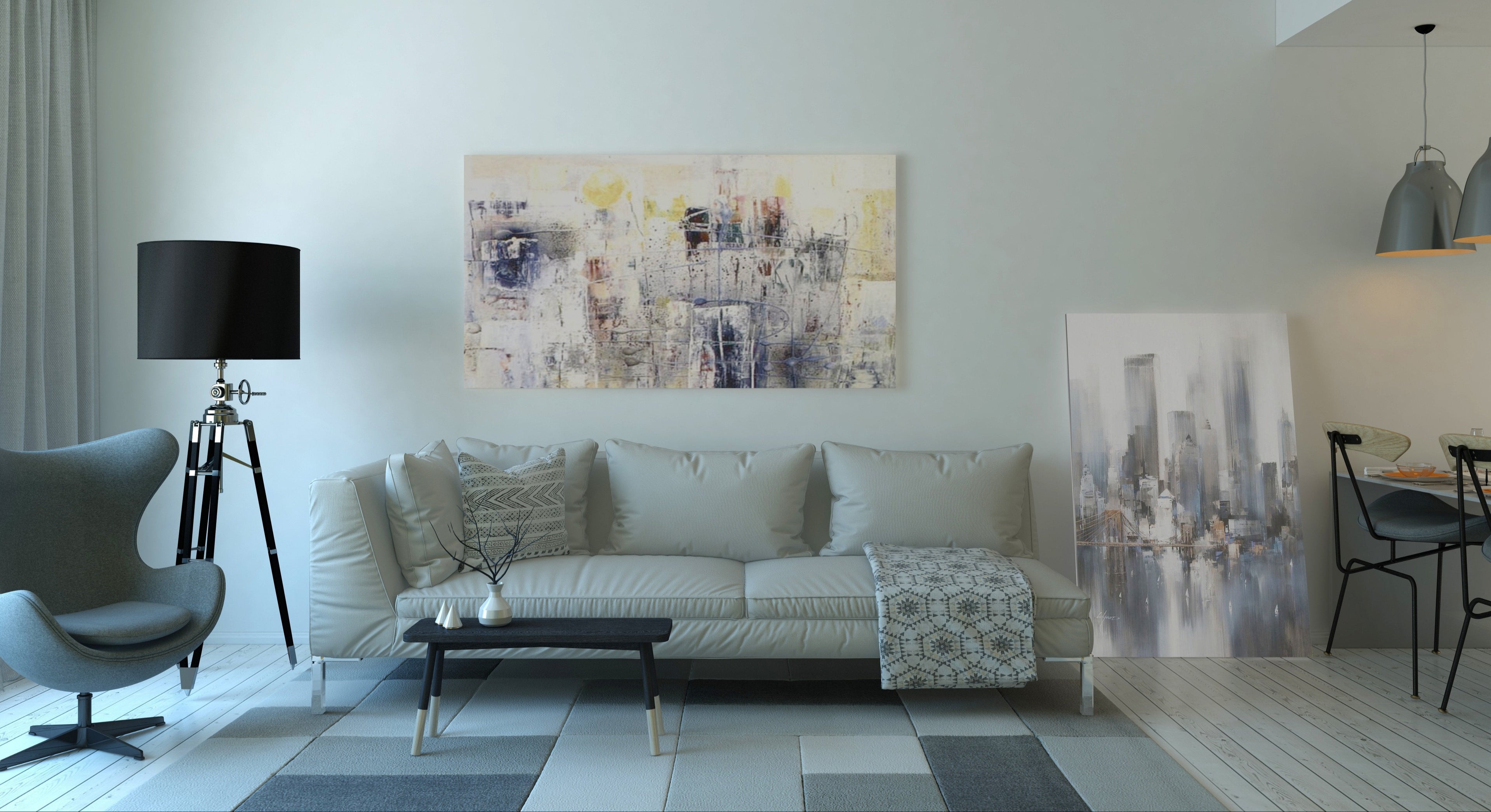 Modern living room with a sofa, coffee table, and wall art.